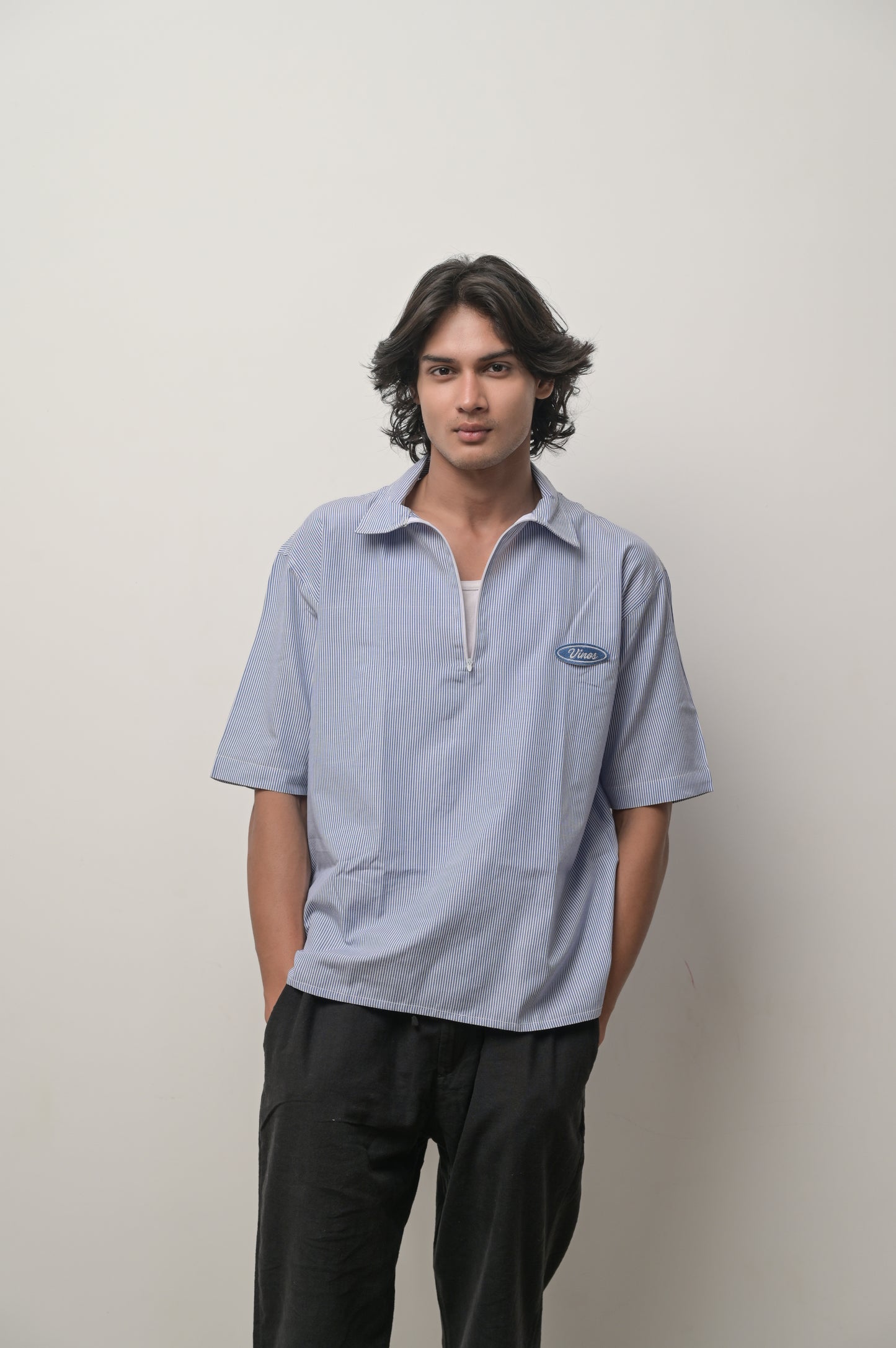 Blue striped shirt with brand logo